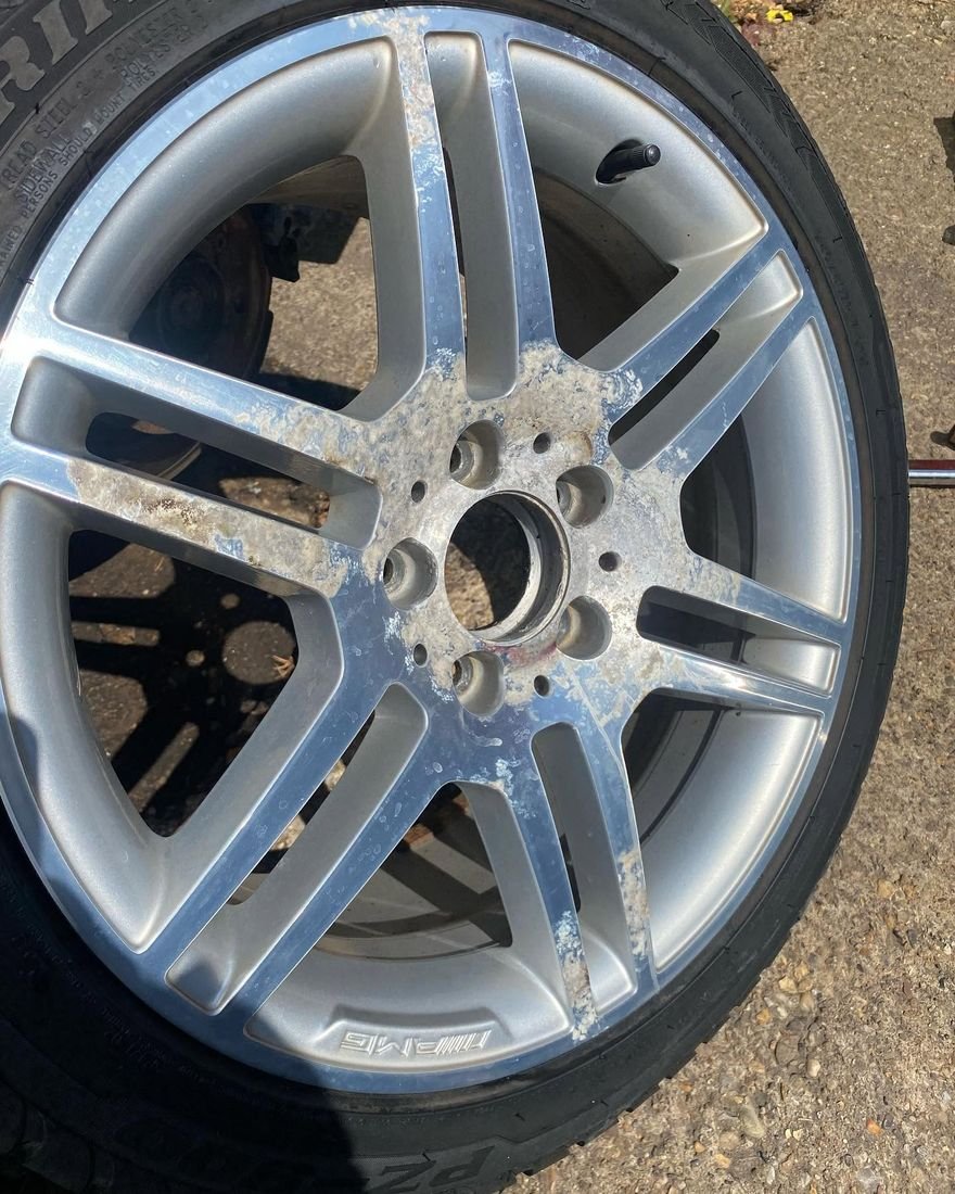 Before: Peeling AMG alloy refinished in graphite