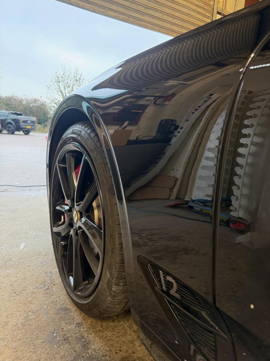 Black Bentley wing refinished by Triple R Paintworx